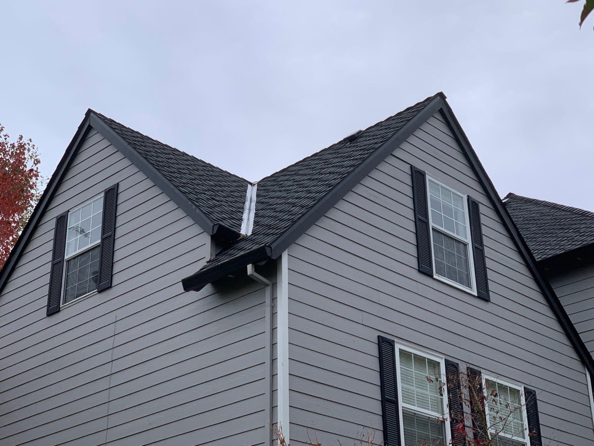 Twin gables with new shingles and fresh flashing in the valley